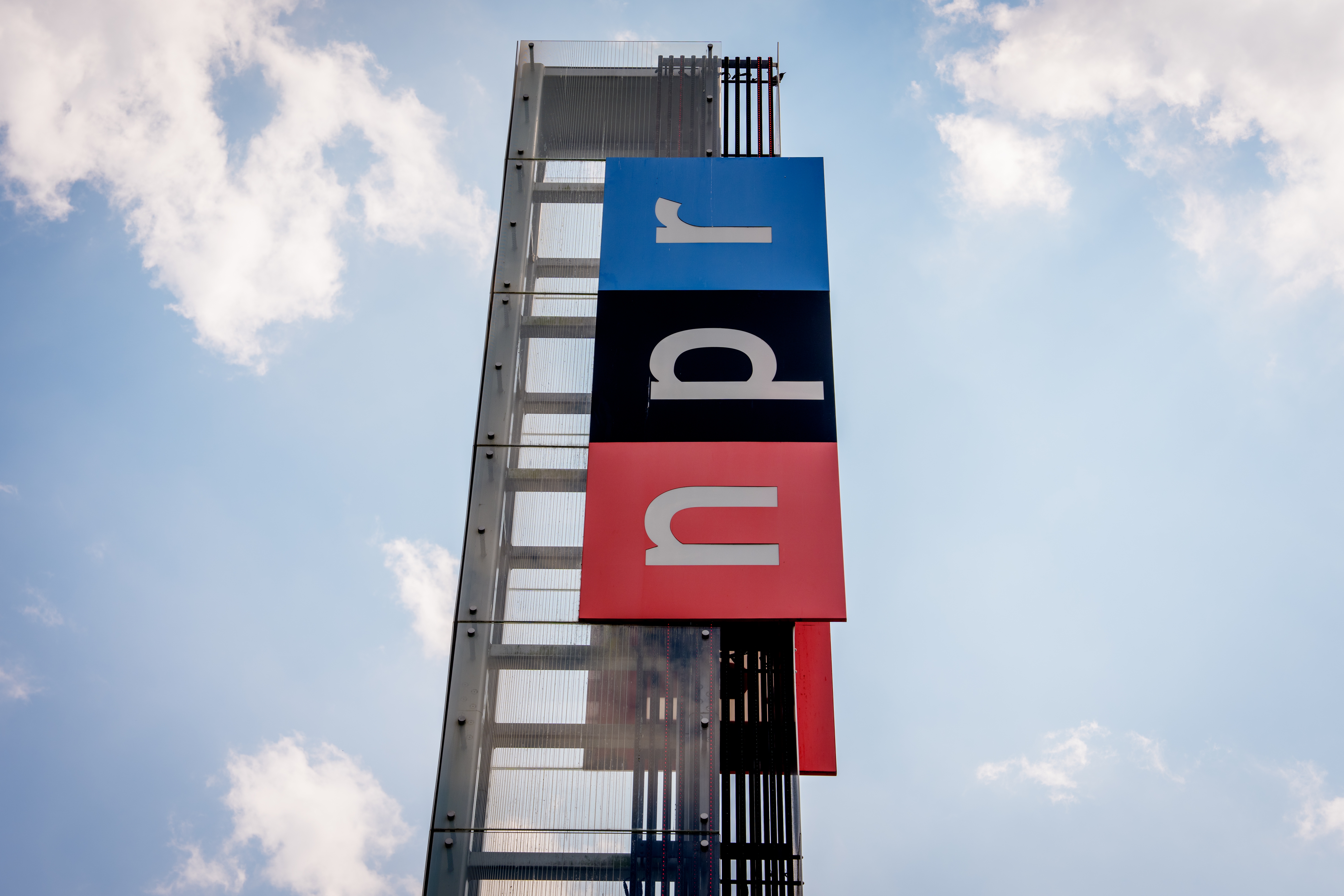 View of the sign outside National Public Radio headquarters on July 22, 2025 in Washington, D.C.